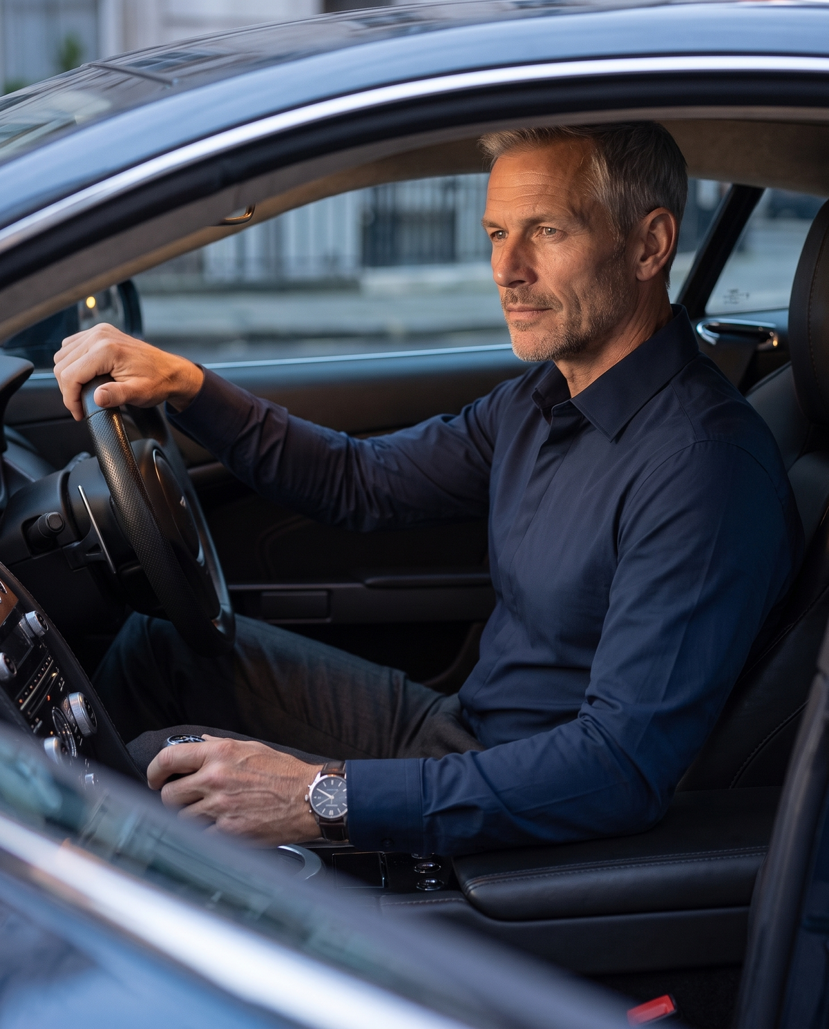 Mature man driving in the navy Alfonso shirt
