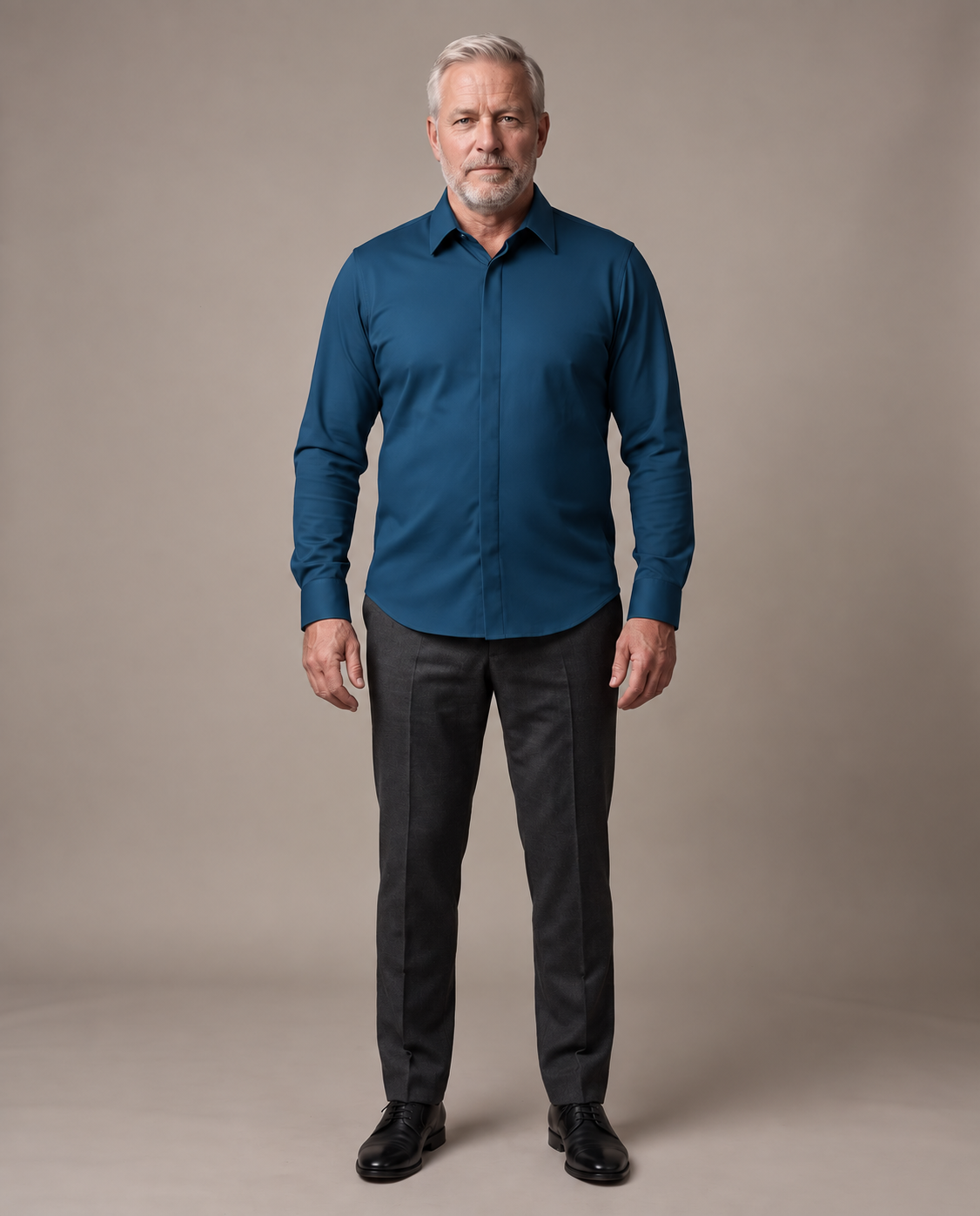 Full silhouette of a broader mature man wearing the navy Alfonso shirt untucked