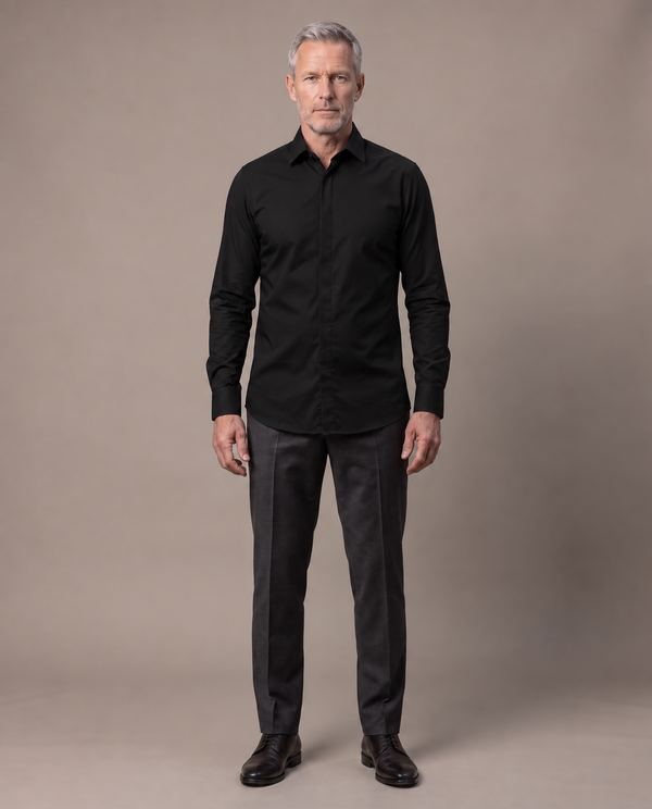 Mature man wearing the Black Alfonso wrinkle-free button-down shirt tucked in